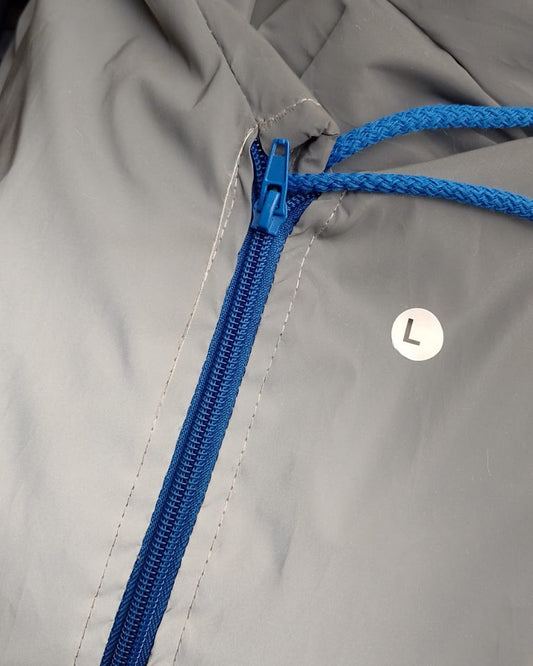 Chaqueta reflectiva con cierre azul rey