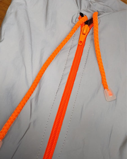 Chaqueta reflectiva con cierre naranja