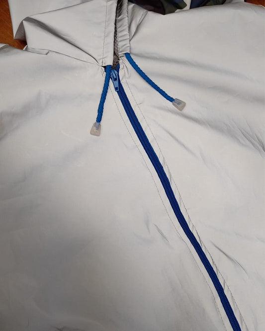 Chaqueta reflectiva con cierre azul rey